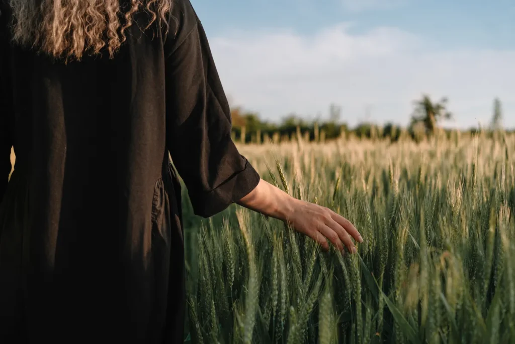 Woman walking through a field reflecting on self-worth and personal growth