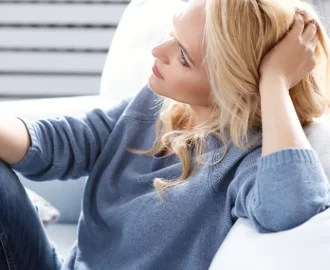 lady sitting in a chair contemplating the menopause and ADHD