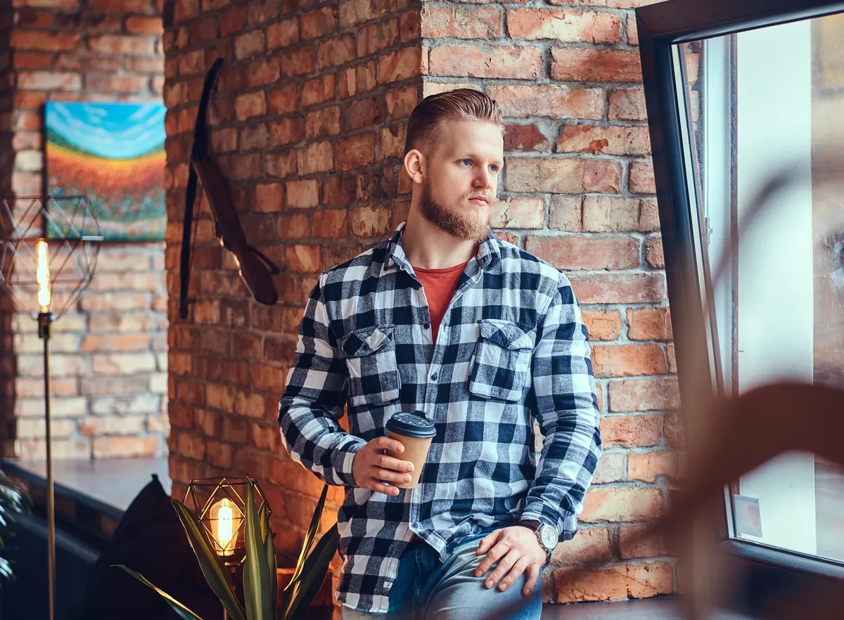 Man reflecting on workplace challenges and ADHD support options