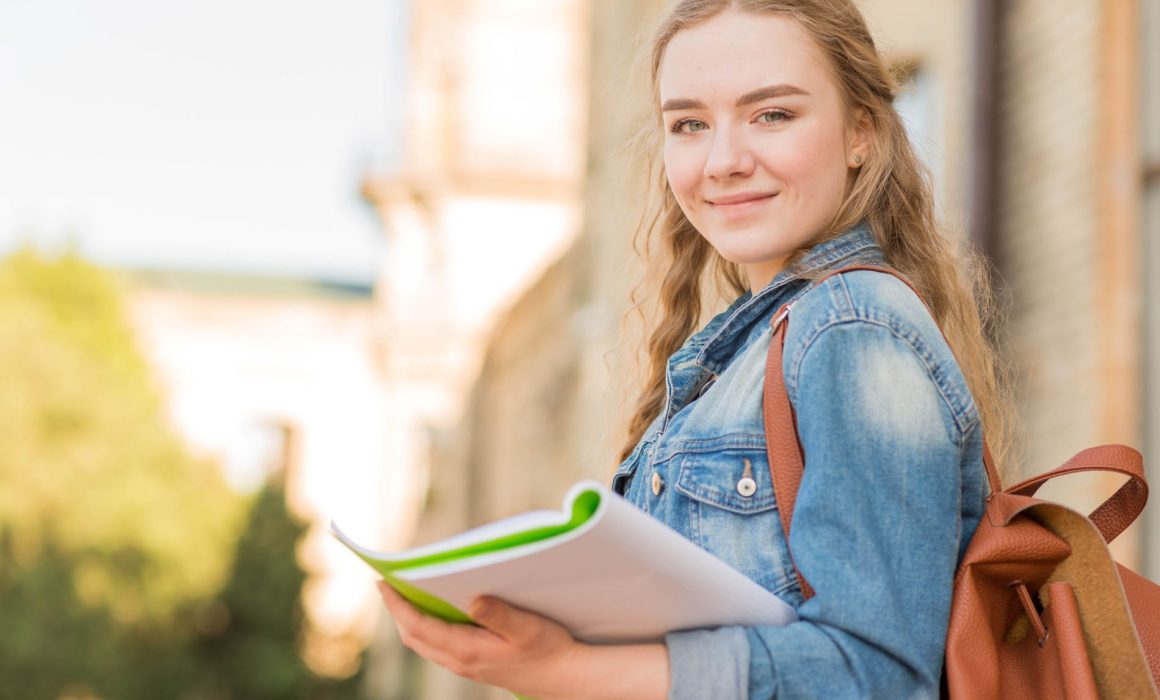 University student with ADHD holding a folder, symbolizing effective daily planning and organisation strategies