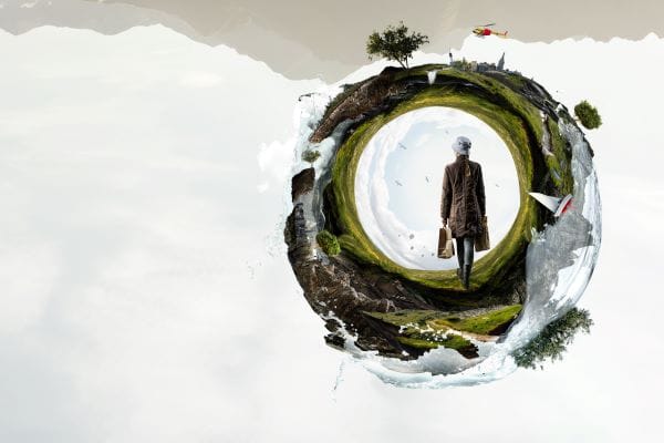 lady with shopping bags walking into green landscape representing life transitions