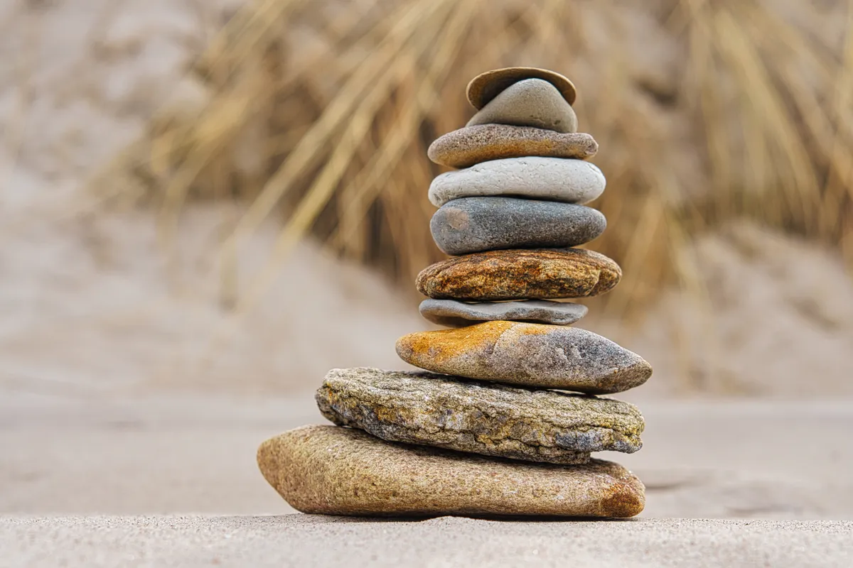 Balanced stack of stones representing ADHD programmes and lasting change.